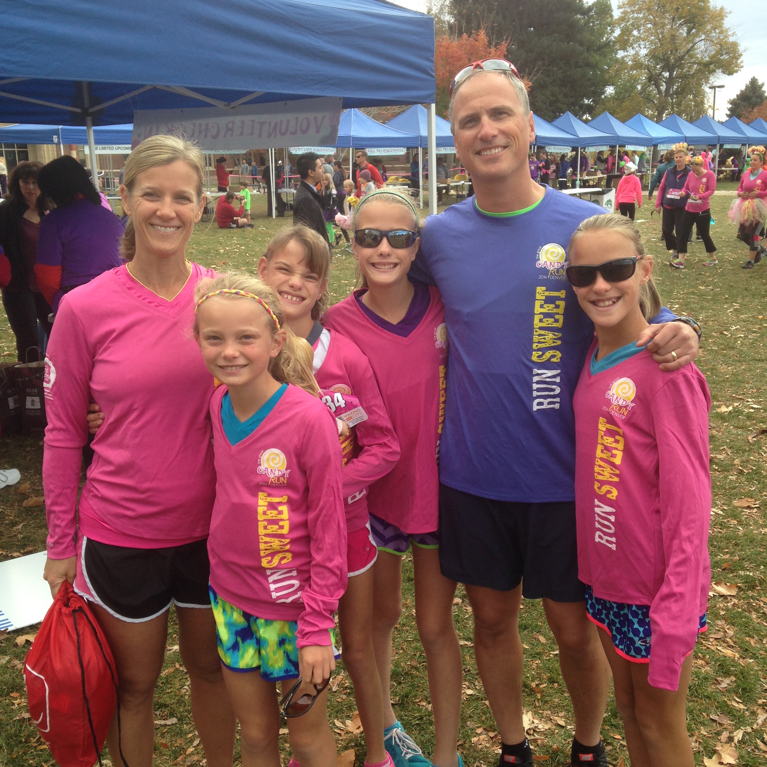 MOther, father, and three kids stand at the great candy run